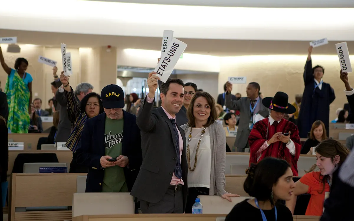Delegates at the UN Human Rights Council in Geneva holding up their country name panels to ask for the floor