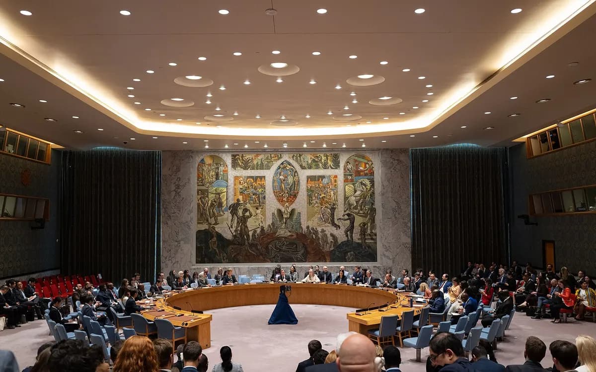 A high-level meeting of the UN Security Council, seen from the gallery, with the chamber mural behind the horseshoe table